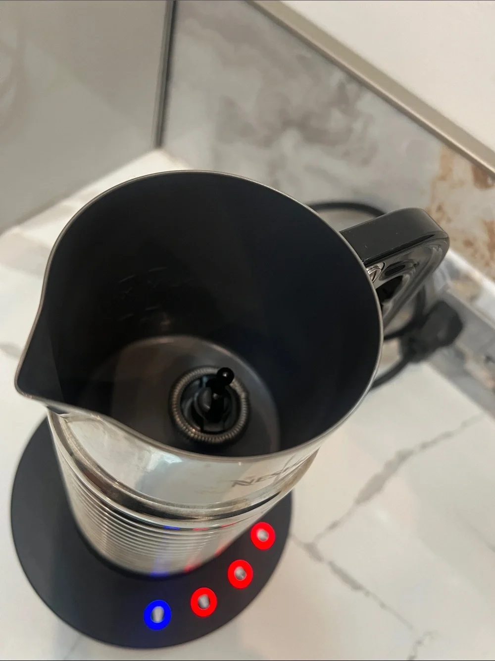 Nespresso Aeroccino 4 Milk Frother, a stainless steel electric milk frother